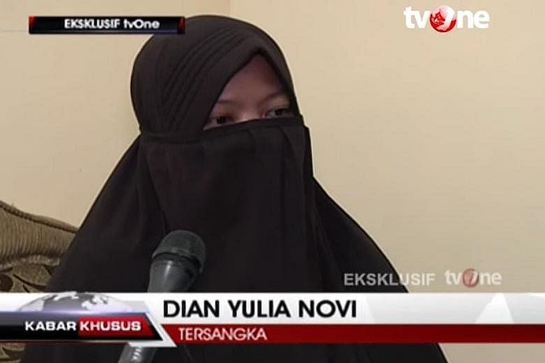 Screen grab from a TVOne interview with Dian Yuli Novi, one of two women held over a suicide-bomb plot to strike the Jakarta presidential palace with a high-grade bomb. The woman said she had worked in Singapore for 11/2 years and was "active" on Fac