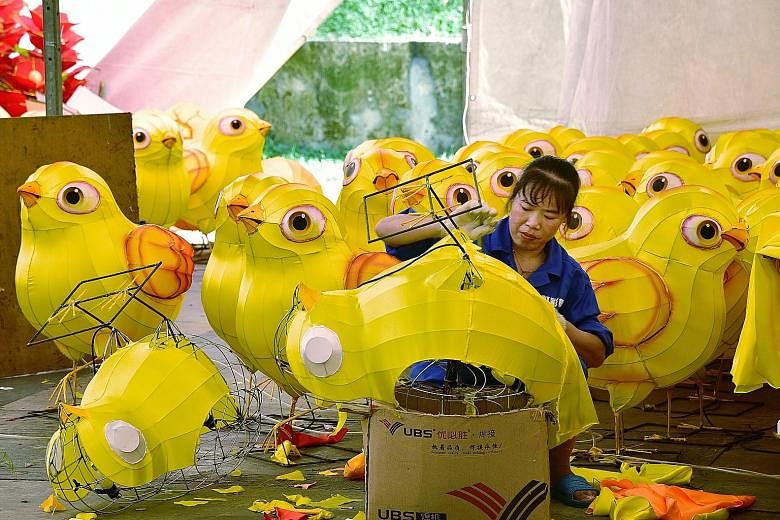 Craftsmen are getting busy assembling cheery "chick" lanterns in Chinatown. 	These lanterns will be featured in the street light-up there next month, as people usher in the Year of the Rooster. 	About 40 craftsmen from China, including 40-year-old Ma