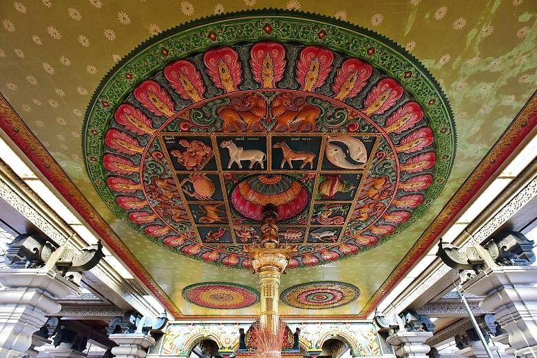 Far left: The ceiling along the covered walkway to the main shrine of Lord Sri Srinivasa Perumal is decorated with a large lotus with the 12 zodiac signs. Left: Yali pillars line the walkway of the temple. With a lion head and human body, the yali is