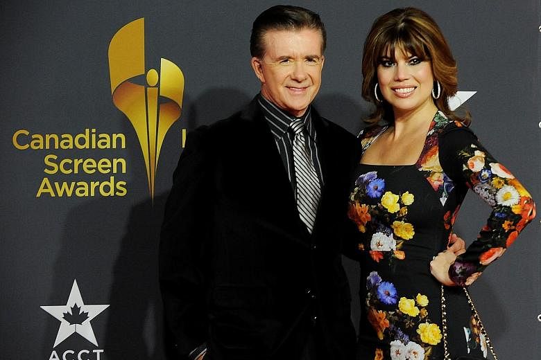 Actor Alan Thicke with his wife Tanya Callau in 2013.
