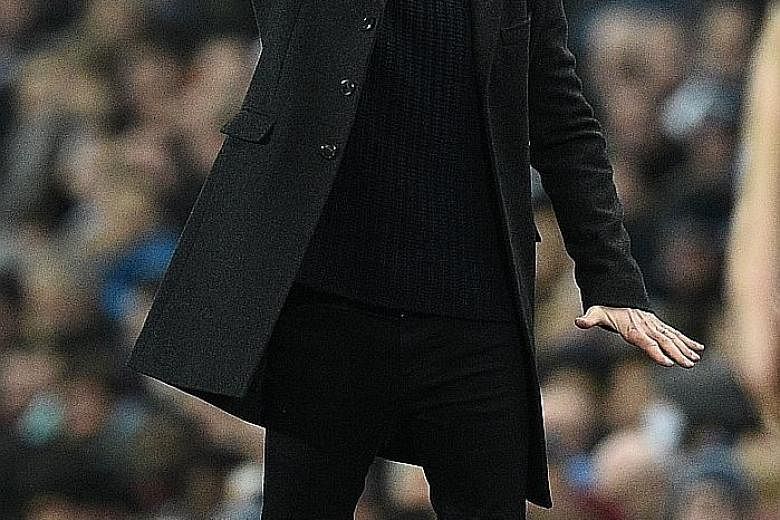Pep Guardiola shouting instructions to his Manchester City players during a match. The Spaniard, who won 21 trophies in seven years as a manager, admitted that he needs more time to adapt to the English game.