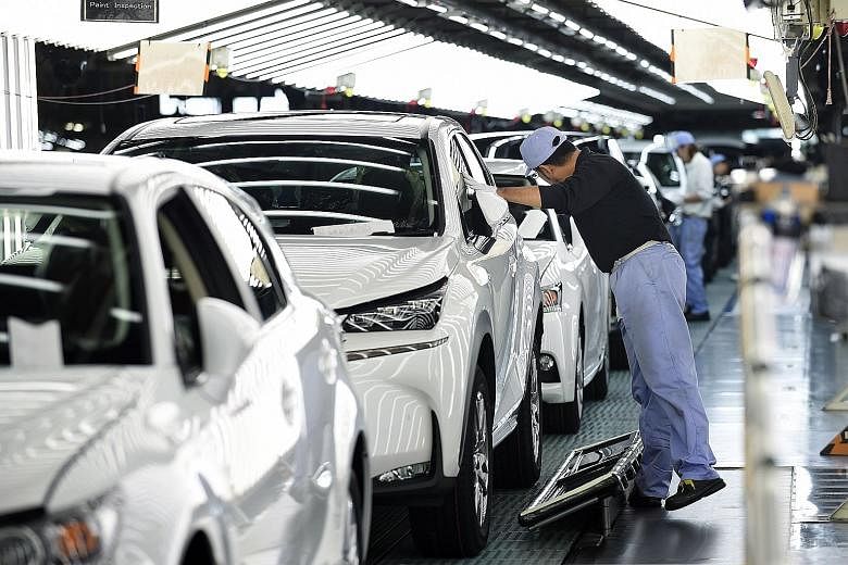 Lexus vehicles on an assembly line at the Miyata Plant in Miyawaka, Fukuoka Prefecture. Auto and machinery makers' sentiment brightened in the tankan survey, which was taken days after the US presidential election last month, suggesting that sharp ye