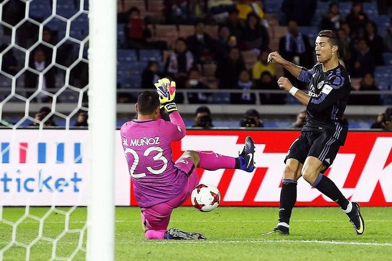 Cristiano Ronaldo beating Club America goalkeeper Moises Munoz with an angled shot in second-half stoppage time in Yokohama. The 11-time European champions, who beat the Mexican outfit 2-0, will play J-league winners Kashima Antlers in Sunday's final
