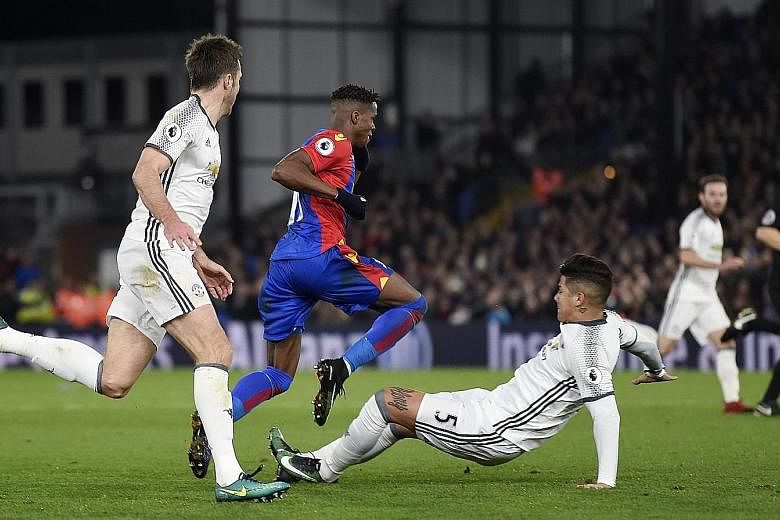 Manchester United defender Marcos Rojo got off with just a yellow card after this two-footed challenge on Wilfried Zaha of Crystal Palace on Wednesday. He was also spared a red card when he used the same tactic against Everton midfielder Idrissa Guey