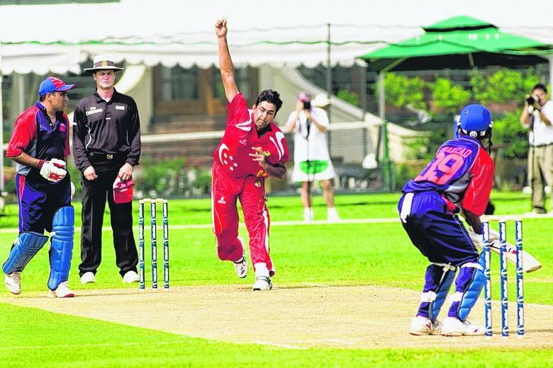 Right: Singapore's Saad Khan Janjua bowls in a match against Bahrain. Singapore were crowned WCL Division 6 champions after winning by 68 runs in the 2009 final at Kallang. Far right: ActiveSG Football Academy participants training at the Kallang Cri