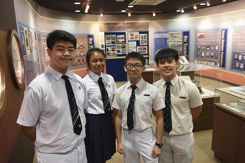 Beatty Secondary School students (from left) Jeremy Loh Ming Rong, Ain Quraisya, Ng Qian Ze and Ryan Goh Jia Jun, all aged 15, at the school's revamped heritage gallery that features history from both Beatty and Balestier Hill secondary schools, which hav