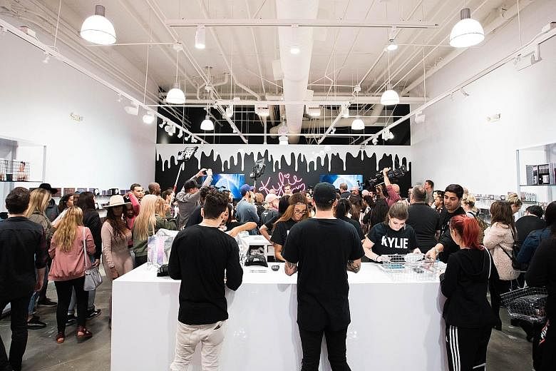Thousands surged to Kylie Jenner's pop-up shop at the Westfield Topanga mall in Los Angeles.
