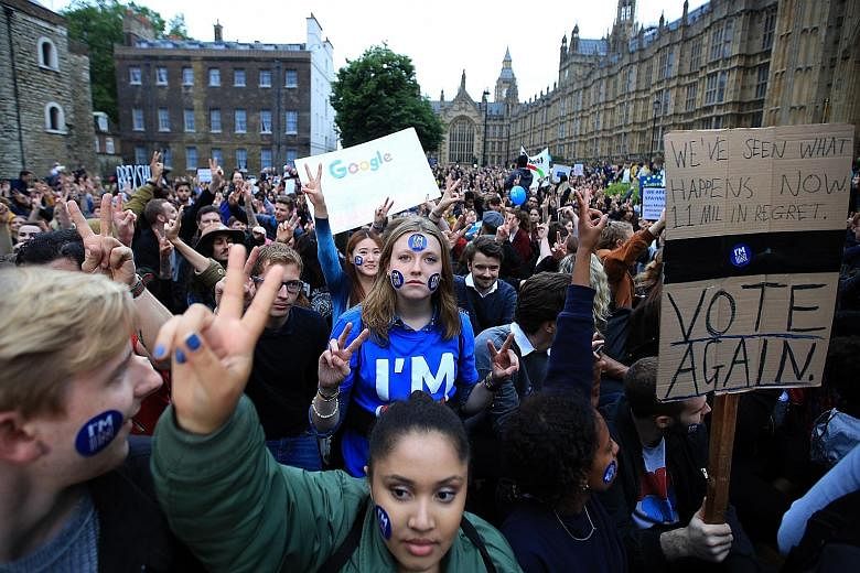Demonstrators outside the Houses of Parliament in London during a protest to show solidarity with the European Union, just days after Britons voted to leave the EU on June 23.