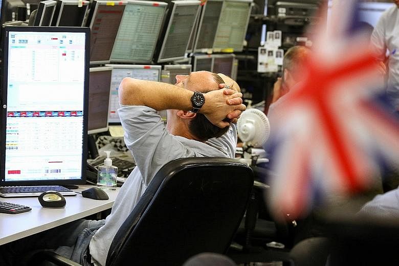 A trader monitoring financial data in London, a global financial centre that is hard to beat.