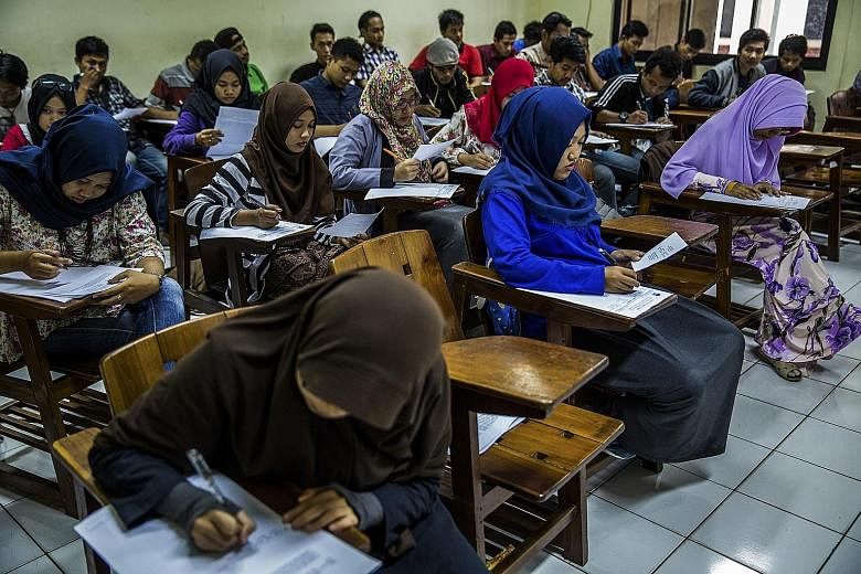 Students at Syarif Hidayatullah State Islamic University in Jakarta. A survey has found that fewer than 10 per cent of Indonesia's 250 million people have a university-level education, and of the country's six million university and postgraduate stud