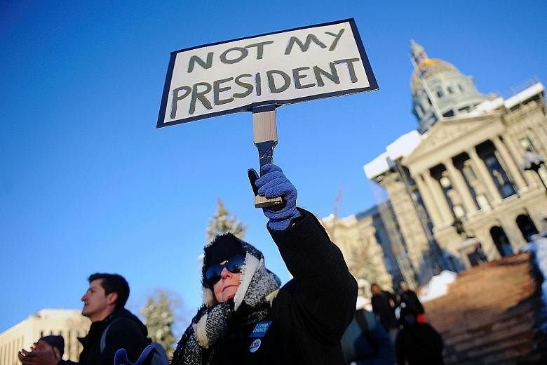 Protesters against President-elect Trump outside the Colorado Capitol building in Denver on Sunday, the eve of the Electoral College vote. Americans who consider him unfit to serve as president have called for Republican electors to block his electio
