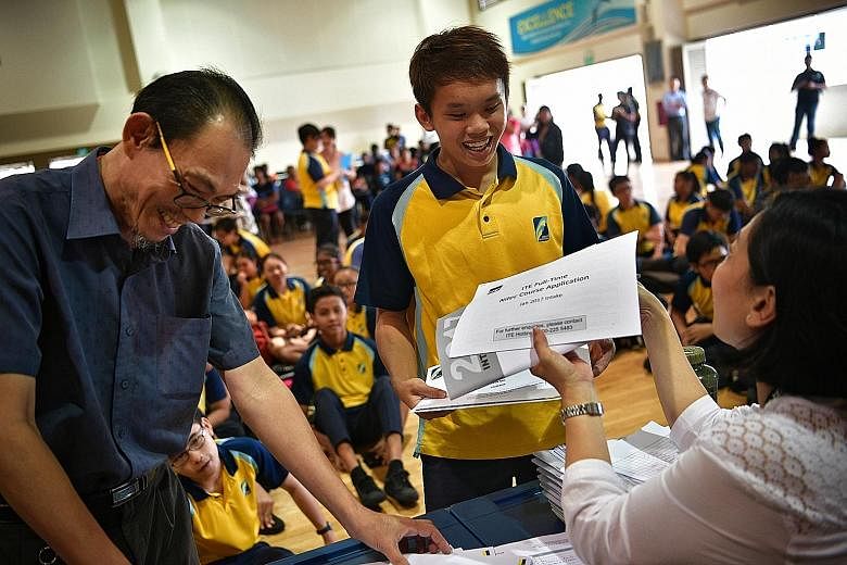 Crest Secondary student Ryan Ang collecting his N-level results yesterday. Ninety-eight per cent of the school's 198 pioneer students passed the N-level exams, higher than the 97.1 per cent pass rate for the national cohort of 5,470 students in the N
