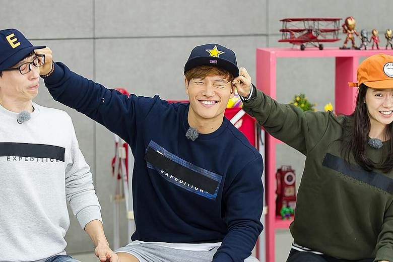 Running Man hosts Kim Jong Kook (centre, with Yoo Jae Suk) and Song Ji Hyo (right) reportedly found out about their ousting from South Korean news last week.