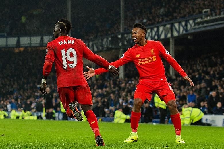 Daniel Sturridge congratulating goal-scorer Sadio Mane after the Reds duo combined for the late winner against Everton.