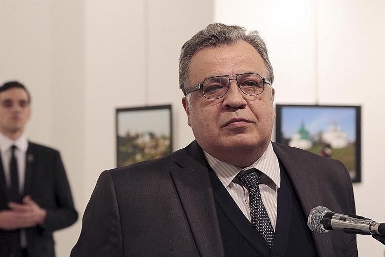 Altintas was seen approaching Mr Karlov (below) before opening fire and killing the Russian Ambassador. The gunman shouted several statements suggesting support for radical Islam (above) before he was killed.