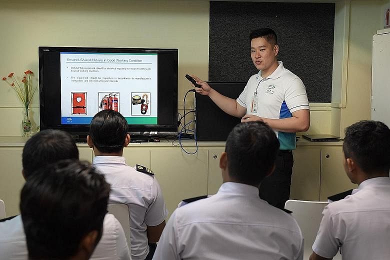 Captain Shawn Ho, 29, briefing Batam Fast crew members yesterday on safety procedures when handling their vessels.