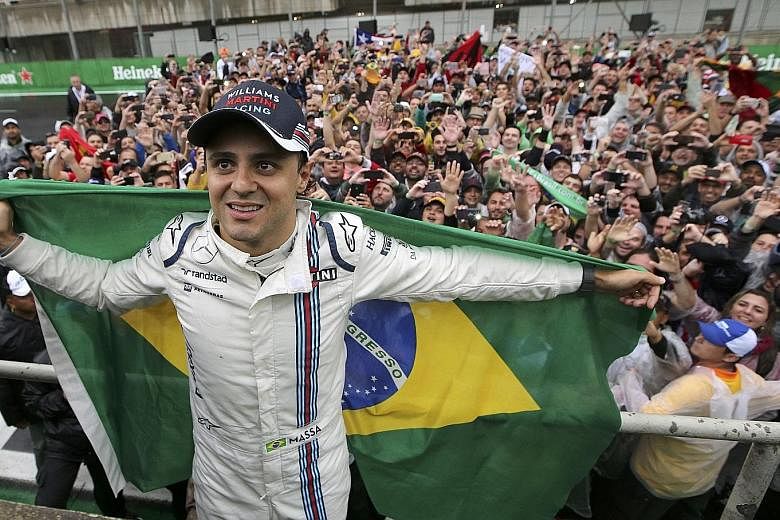 Felipe Massa with fans at the Interlagos circuit last month. The Brazilian, who retired at the end of the season, is slated to do an about-turn and return to drive for Williams next year.