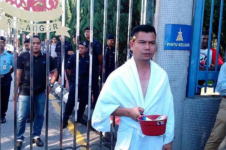 Mr Jamal - holding a water dipper filled with toiletries, and with a toothbrush tucked behind one ear - demanded to take a shower at the Menteri Besar's office after a water supply cut at his house in Ampang.