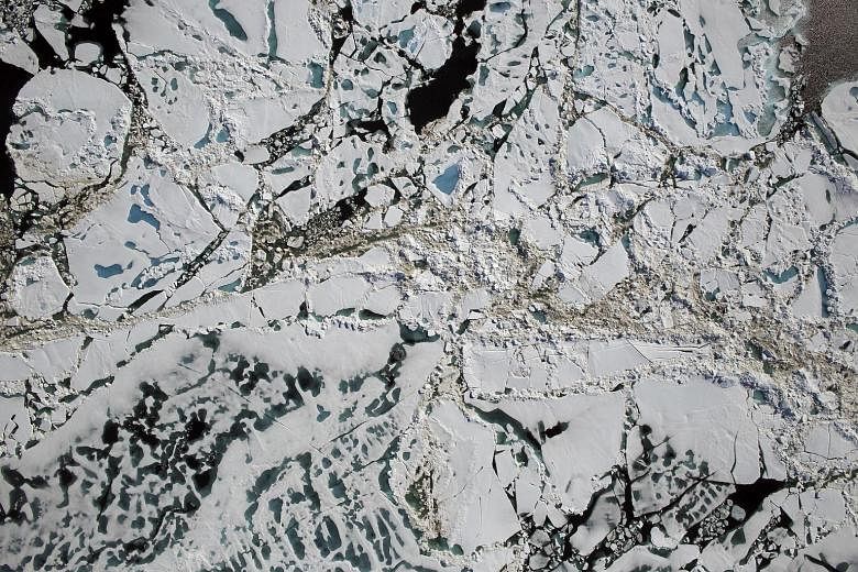 An aerial photo by Nasa showing sea ice, melt ponds and areas of open water in the Chukchi Sea of the Arctic Ocean. Scientists have been startled by extreme warmth in the Arctic in the past two months.