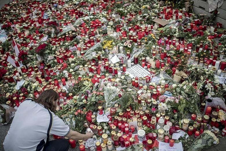 Candles, flowers and letters of condolence were placed at the Breitscheidplatz Square in remembrance of the victims of the Berlin Christmas market attack on Monday, which killed 12 people and injured 48 others.