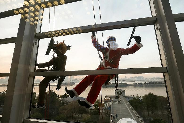 The work put in by window cleaners in Tokyo, dressed as Santa Claus and reindeer, may not be high-tech, but it gives a real, tangible benefit to the city when visitors are vowed by its clean and well-run image.