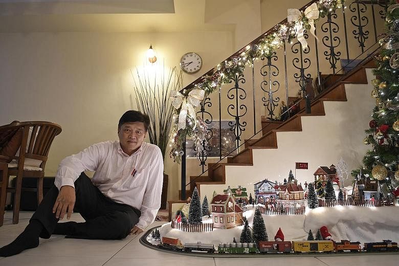 Mrs Sharene Chen-Johandyputra uses garden roses and peonies to achieve a dreamy-looking tablescape. Christmas decorations line the outside of Mr and Mrs Richard Lim's two-storey semi-detached house in Seletar Hills Estate. The centrepiece in Mr Mark 
