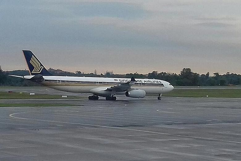 The SIA flight from Tokyo waited for three hours for a parking bay at the Batam airport. It eventually arrived at Changi airport five hours behind schedule.