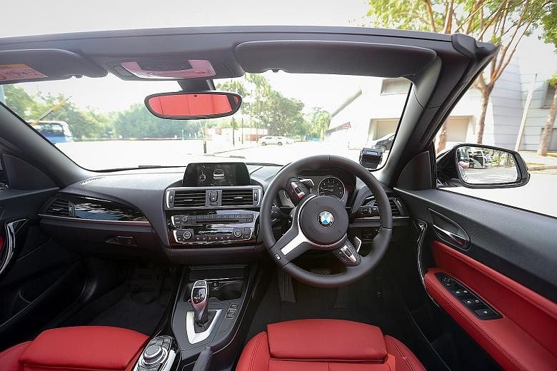 Interiors of the BMW M240i convertible (left) and M140i five-door hatchback (below). The BMW M240i convertible (far left) and M140i five-door hatchback clock the century sprint in 4.7 and 4.6 seconds.