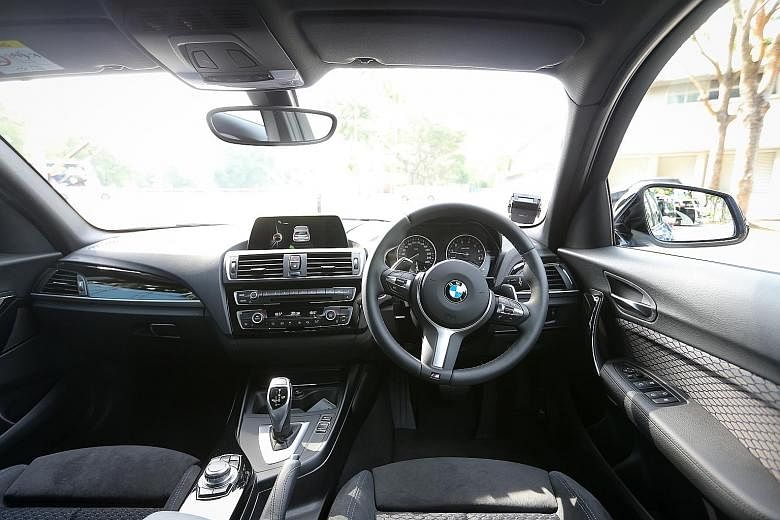 Interiors of the BMW M240i convertible (left) and M140i five-door hatchback (below). The BMW M240i convertible (far left) and M140i five-door hatchback clock the century sprint in 4.7 and 4.6 seconds.