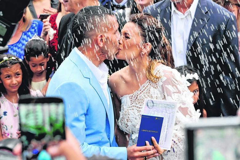 Argentinian football star Carlos Tevez and his teenage sweetheart Vanesa Mansilla after being pronounced man and wife in San Isidro, Buenos Aires, on Thursday. Soon, the already wealthy family will head East on their Chinese adventure, as will Brazil