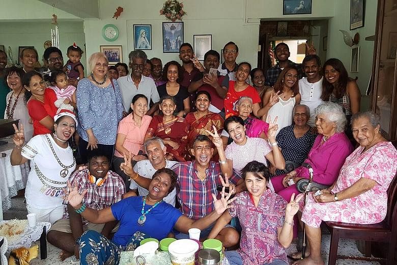 For 30-plus years, cross-cultural and multi-religious harmony has been the theme of Christmas gatherings at the home of Ms Angela Christina Perumal-Schooling (front row, in blue). While her father's side of the family is Hindu, her mother's side is C