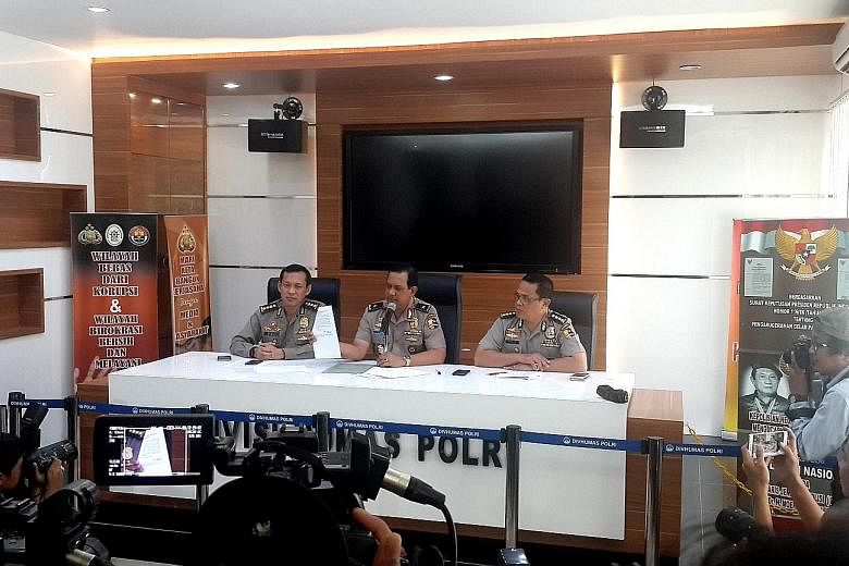Police spokesman Rikwanto showing letters with instructions from Abu Faiz, leader of the cell that planned to attack a police post in Purwakarta in West Java. Police have been stepping up raids ahead of Christmas and New Year's Eve.