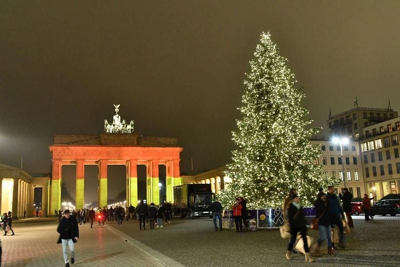 Germany's Brandenburg Gate being illuminated in the colours of the German flag on Dec 20, to commemorate the victims of the previous day's attack on a Christmas market in Berlin. 