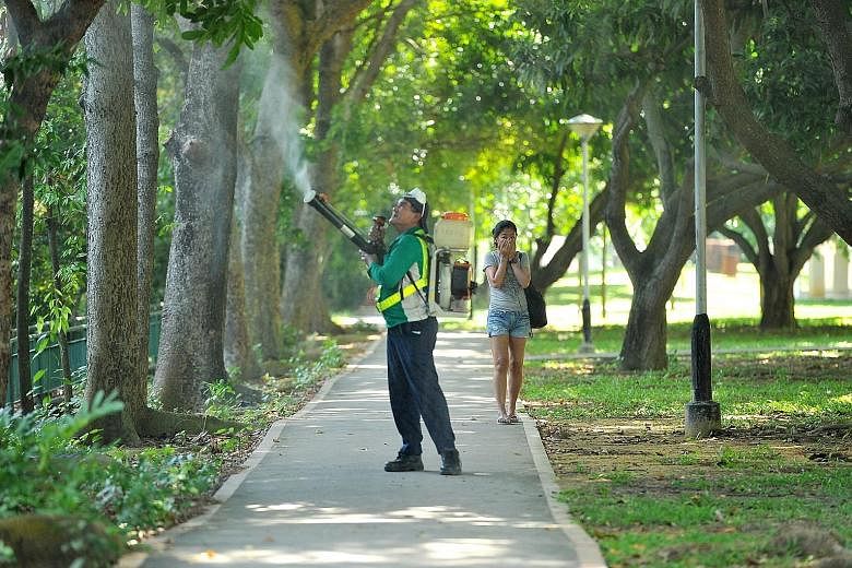 A National Environment Agency officer spraying insecticide around Block 101, Aljunied Crescent, on Sept 2. Aljunied Crescent was one of the first areas to be identified as a Zika cluster. While Zika numbers have tapered off in recent weeks - no new Z