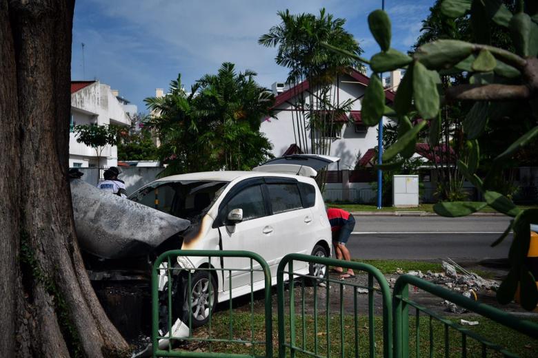Car catches fire after crashing into tree at Lorong Chuan | The Straits ...