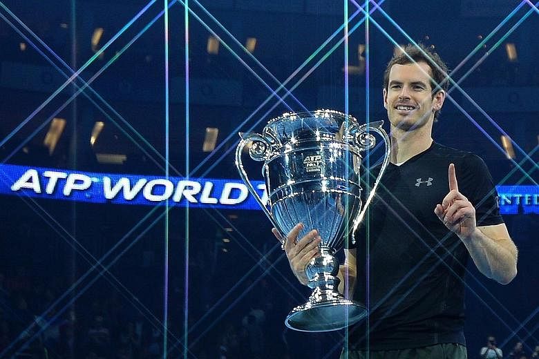 Top: Britain's Andy Murray posing with the ATP World Number One trophy after finishing as the year-end world No. 1 at the season-ending ATP World Tour Finals in London last month. Above: Women's tennis world No. 1 Angelique Kerber of Germany posing a