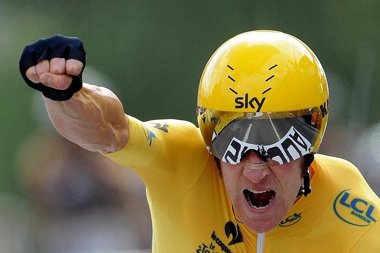 Bradley Wiggins celebrating winning the 2012 Tour de France during the final stage of the event. The Briton announced his retirement from cycling on Wednesday after winning eight Olympic medals.