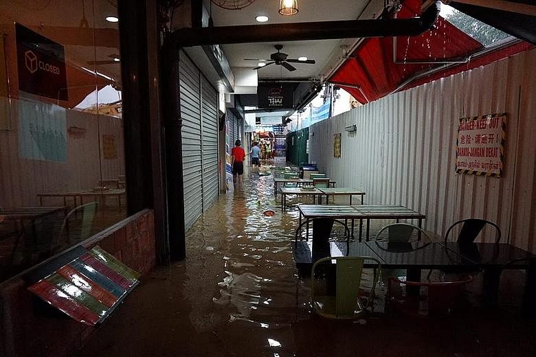 Eateries and shops along Upper Thomson Road were flooded last Saturday. Tenants said they racked up thousands of dollars in losses.