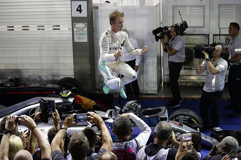 Nico Rosberg celebrating after the Singapore night race on Sept 18. With his first win at Marina Bay and his eighth of the season, he leapfrogged Lewis Hamilton, who finished third, to take an eight-point lead which he never relinquished.Below: The b