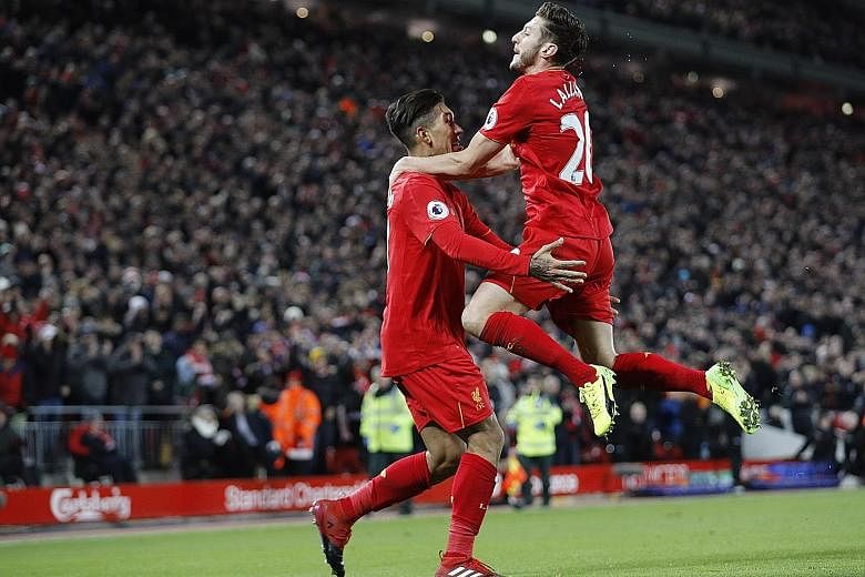 Roberto Firmino celebrating with Adam Lallana after scoring Liverpool's second goal against Stoke, in their 4-1 win at Anfield on Tuesday. A draw today at the same venue is of little benefit to either the Reds or City, with leaders Chelsea surging ah