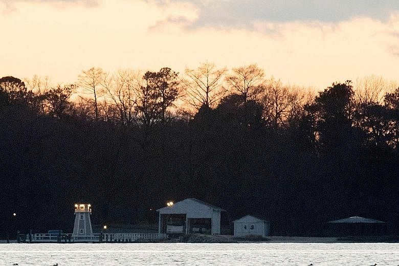 Above: The Killenworth estate in Glen Cove, New York, speculated to be the second compound being shut down. Left: A dock at the compound in Maryland, outside Washington, one of two luxury compounds described by US officials as beachside spy nests use