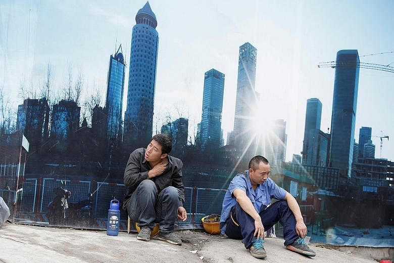 A construction site in Beijing's central business district. The focus on liberalising the financial sector should support China's strategic shift towards services, but the guidelines issued yesterday by the National Development and Reform Commission 