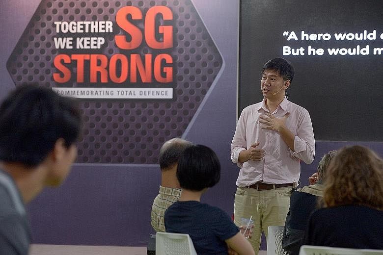 Facilitator Tong Yee (standing) at an SGfuture dialogue on the Singaporean DNA in February. More than 8,300 people took part in discussions under the SGfuture series.