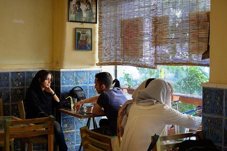 Above: Ferdowsi Cafe attracts mostly young people and couples. Once a month, it serves as an exhibition space for local artists. Bands are invited for performances, while artists hang photographs and paintings on the walls. Below: The century-old Aza