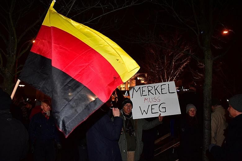 Sympathisers of German populist party AfD calling for Chancellor Merkel to leave during a protest after the attack at the Christmas market in Berlin last month. The EU today is more vulnerable to external aggression than it has been in 25 years, and 