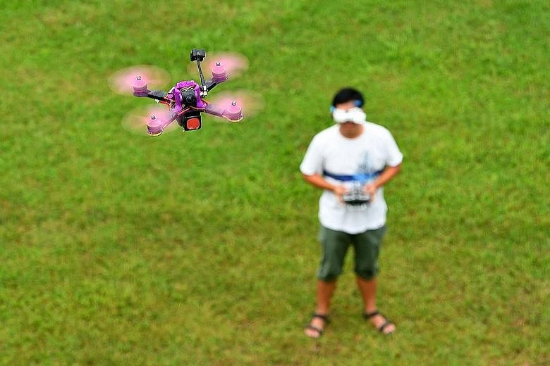 When he pilots his drone using goggles and a remote controller, engineer Alvin Yeoh, 36, feels like Superman, soaring through space as he sees the world through the camera mounted on the flying machine. The drone-racing enthusiast was one of eight pa