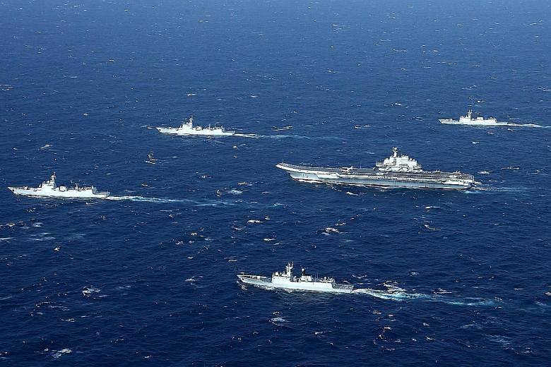 The Liaoning (centre) and its accompanying ships during military drills in the South China Sea on Monday.