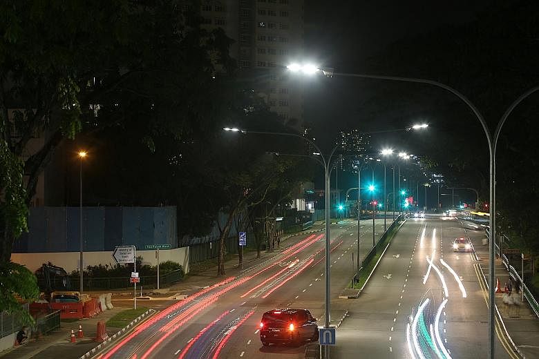 LED street lights, like these in Toa Payoh Lorong 1, emit white light and are about 25 per cent more energy efficient than the conventional high pressure sodium vapour lamps (far left).