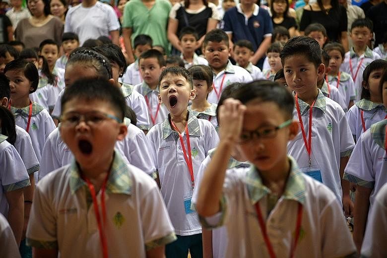 The new school year seems to have arrived a bit too early for some Primary 1 pupils at Westwood Primary School in Jurong West, seen here during morning assembly. They were among the 37,500 or so children across 190 schools who started primary school 