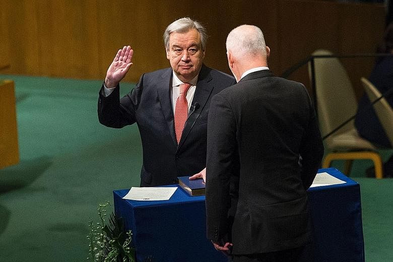 Mr Guterres (left) being sworn in as UN Secretary-General by the president of the General Assembly, Mr Peter Thomson, on Dec 12 last year at the United Nations in New York.